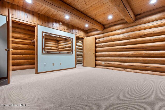 empty room featuring recessed lighting, beam ceiling, and carpet