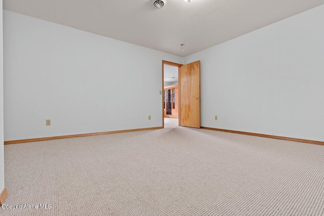 unfurnished room featuring visible vents, baseboards, and carpet floors