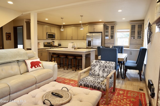living room featuring recessed lighting and light wood-type flooring