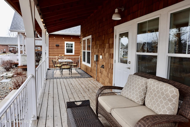 deck with outdoor dining area