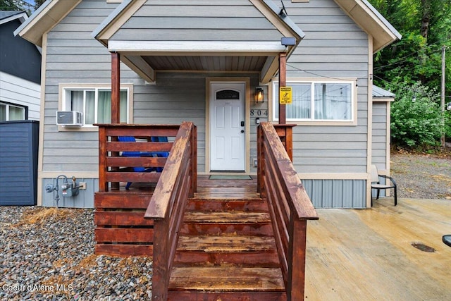 804 Residence St, Wallace, ID 83873 - view of exterior entry with cooling unit and a wooden deck