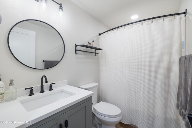 full bathroom featuring vanity and toilet