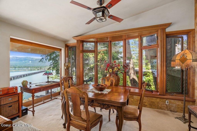 154 W Eagle Crest Dr, Sagle, ID 83860 - dining room with vaulted ceiling, light carpet, a ceiling fan, and a water view