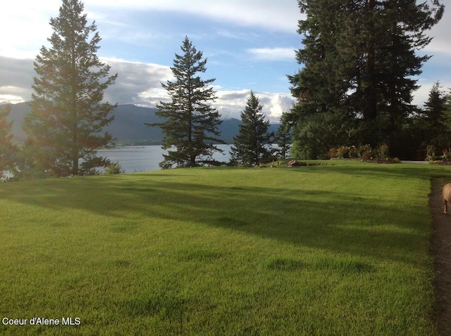 154 W Eagle Crest Dr, Sagle, ID 83860 - view of green lawn with a water and mountain view