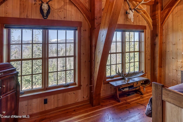 details featuring wooden walls and wood finished floors