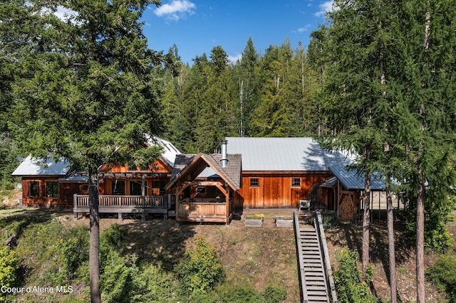 back of property with metal roof
