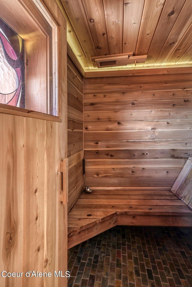 view of sauna with brick floor