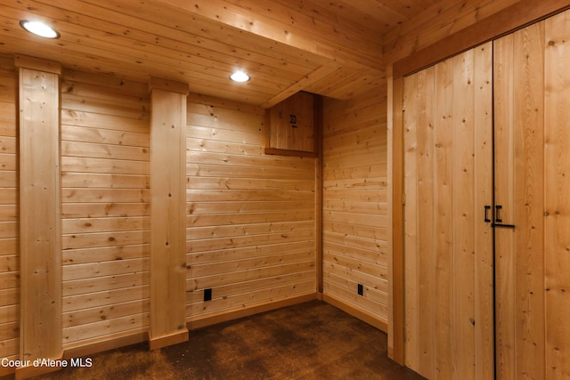 empty room with a sauna, recessed lighting, and wooden walls