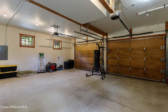 garage featuring a garage door opener and electric panel