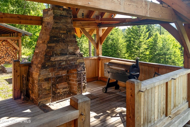 wooden deck featuring grilling area