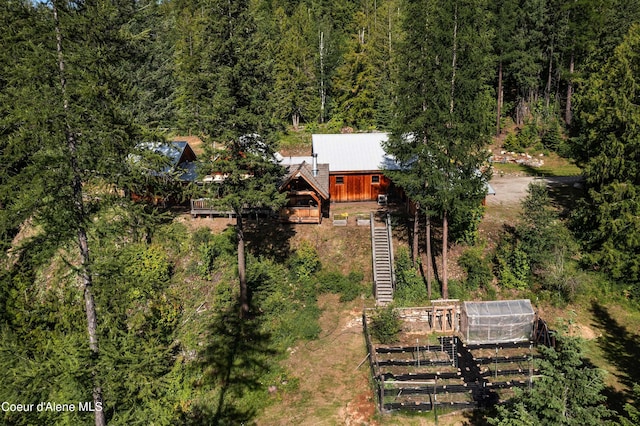 aerial view featuring a wooded view