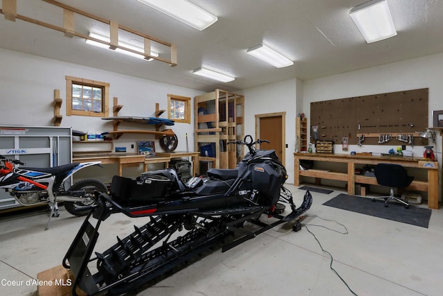 garage with a workshop area
