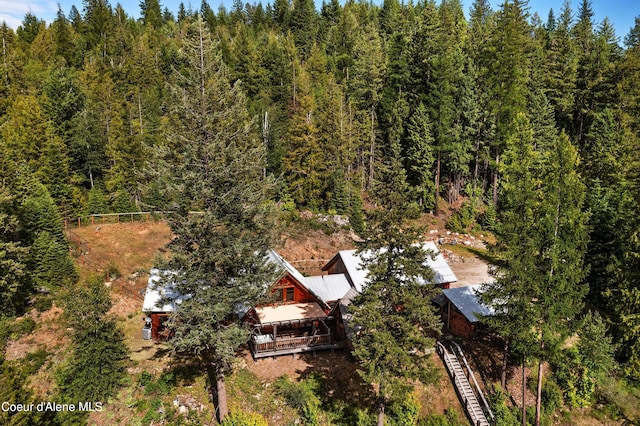 birds eye view of property with a forest view
