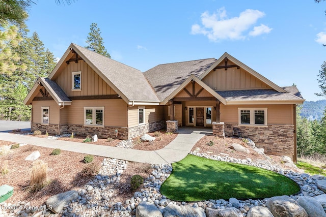 1122 S Four Winds Rd, Coeur Dalene, ID 83814 - craftsman house featuring board and batten siding, stone siding, and roof with shingles