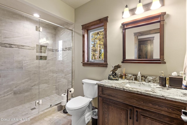 1122 S Four Winds Rd, Coeur Dalene, ID 83814 - bathroom with toilet, a stall shower, and vanity