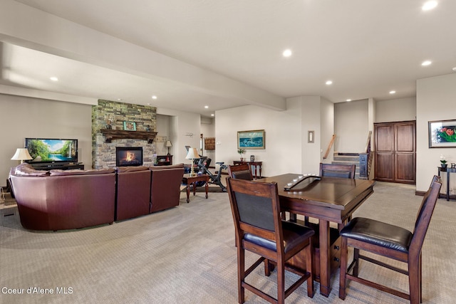 1122 S Four Winds Rd, Coeur Dalene, ID 83814 - dining room with recessed lighting, stairs, light colored carpet, and a fireplace