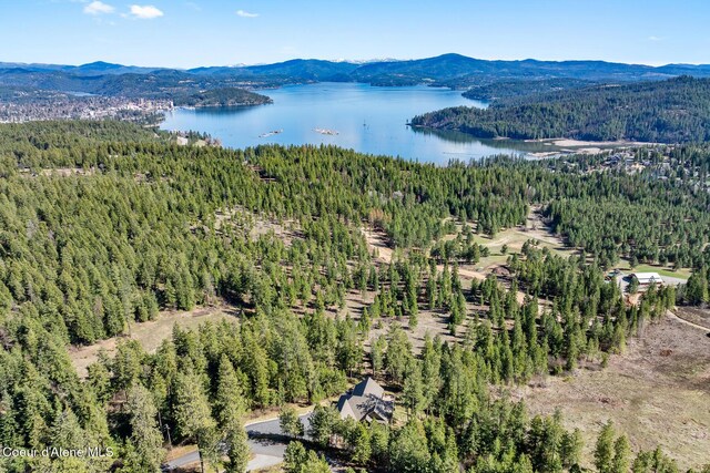 1122 S Four Winds Rd, Coeur Dalene, ID 83814 - drone / aerial view featuring a wooded view and a water and mountain view