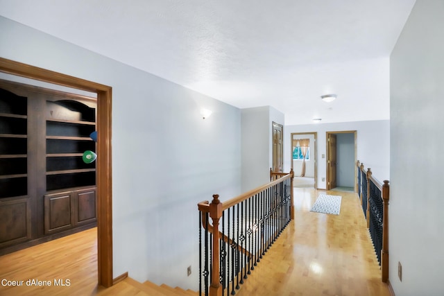 234 Stoneridge Rd, Blanchard, ID 83804 - hall with an upstairs landing and light wood-style floors