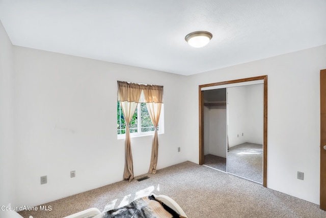 234 Stoneridge Rd, Blanchard, ID 83804 - unfurnished bedroom with a closet, carpet flooring, and visible vents