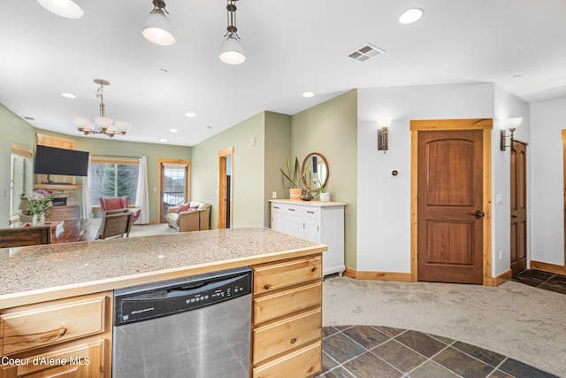 kitchen with stainless steel dishwasher, dark carpet, visible vents, light countertops, and a notable chandelier