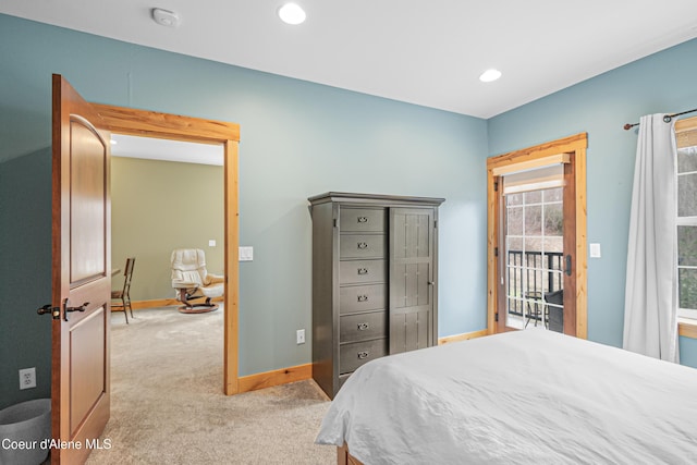 bedroom with access to exterior, recessed lighting, light carpet, and baseboards