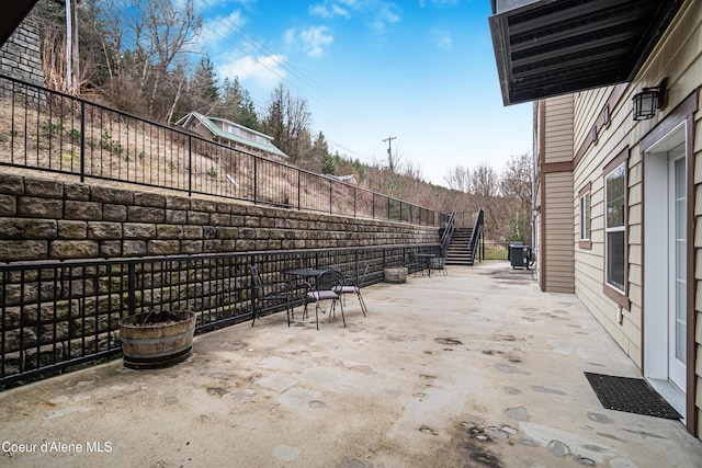 view of patio / terrace featuring fence