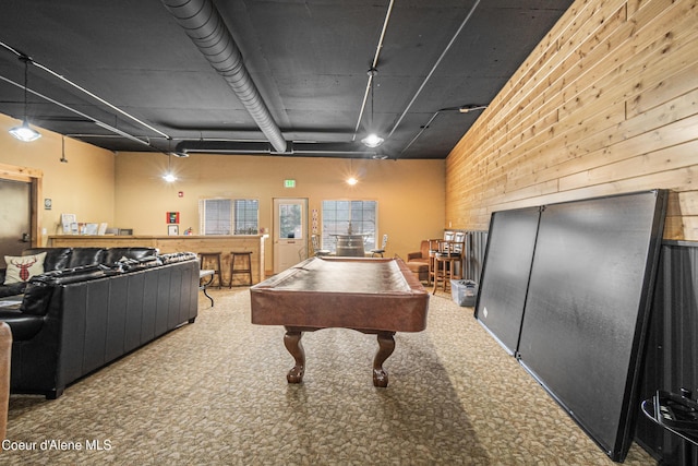 rec room featuring wooden walls, billiards, carpet, and a high ceiling