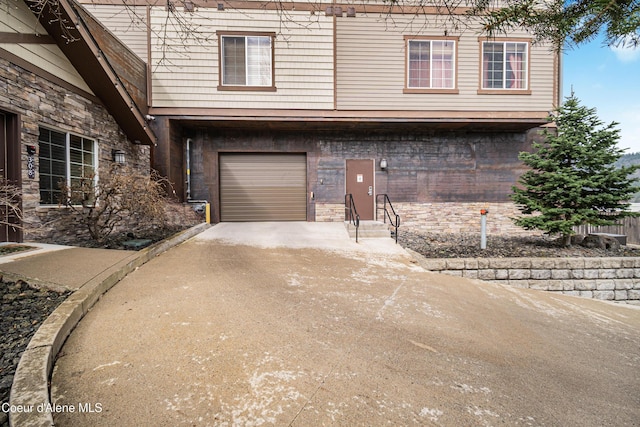 view of front of property featuring a garage and concrete driveway