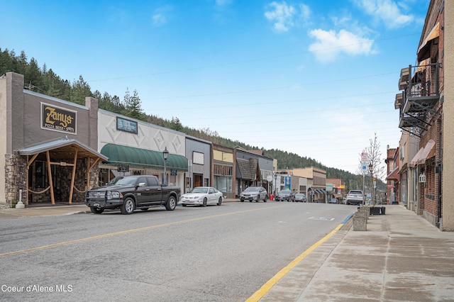 view of street with sidewalks and curbs