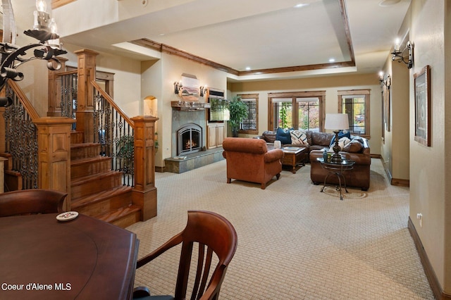 16917 S Basalt Dr, Coeur Dalene, ID 83814 - living room featuring carpet, a fireplace, stairway, a tray ceiling, and crown molding