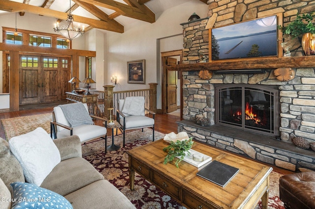 16917 S Basalt Dr, Coeur Dalene, ID 83814 - living area featuring high vaulted ceiling, beamed ceiling, wood finished floors, a chandelier, and a fireplace