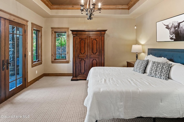 16917 S Basalt Dr, Coeur Dalene, ID 83814 - bedroom featuring a tray ceiling, access to exterior, a chandelier, light colored carpet, and ornamental molding