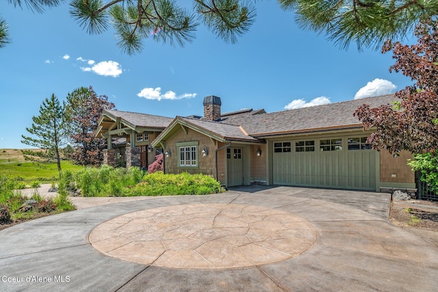 16917 S Basalt Dr, Coeur Dalene, ID 83814 - ranch-style house featuring curved driveway, an attached garage, and a chimney