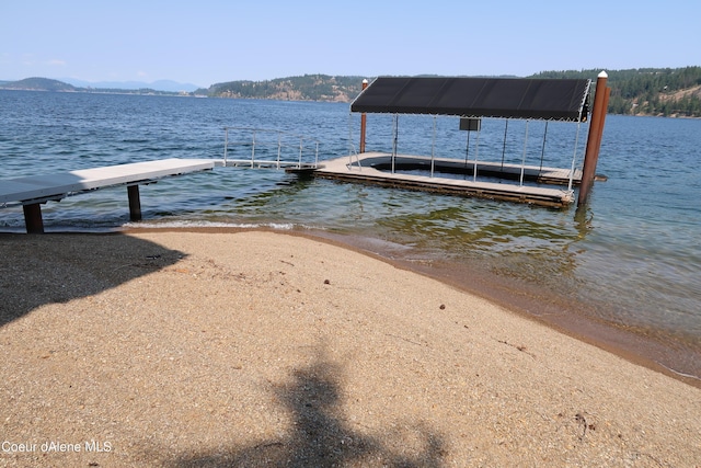 view of dock with a water view