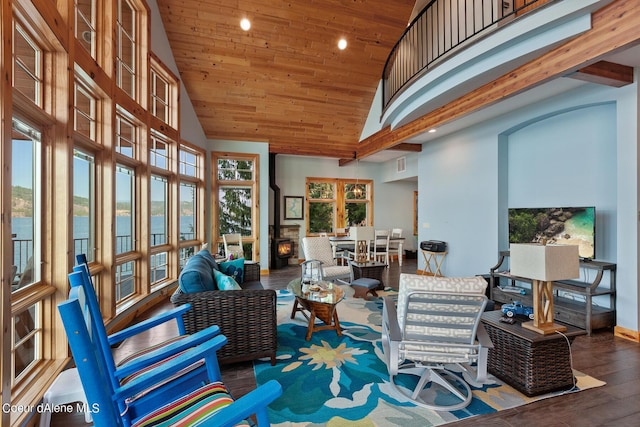 sunroom / solarium featuring a water view