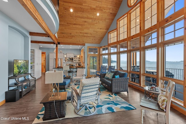 living room featuring a water view, high vaulted ceiling, and wood finished floors