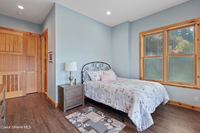 bedroom featuring baseboards, recessed lighting, and dark wood-style floors