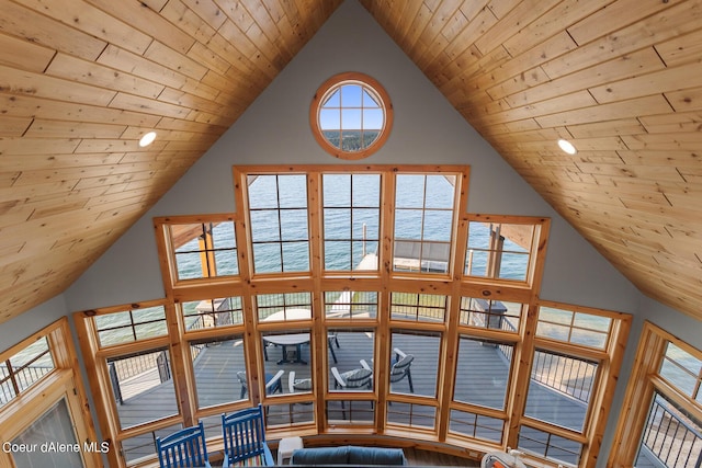 interior details featuring wooden ceiling, recessed lighting, and a water view