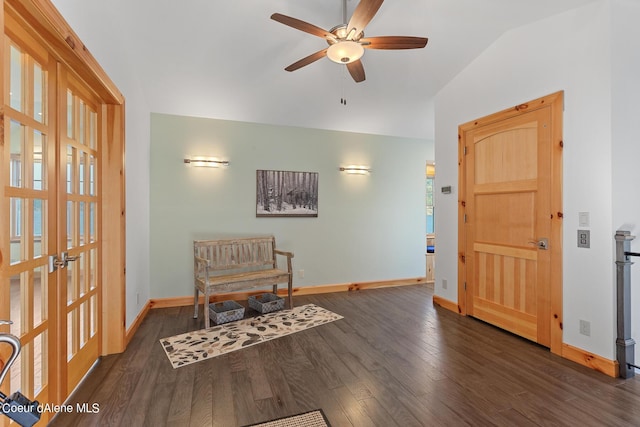 living area featuring baseboards, a ceiling fan, wood finished floors, and lofted ceiling
