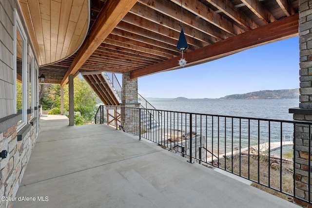 view of patio / terrace featuring a water view