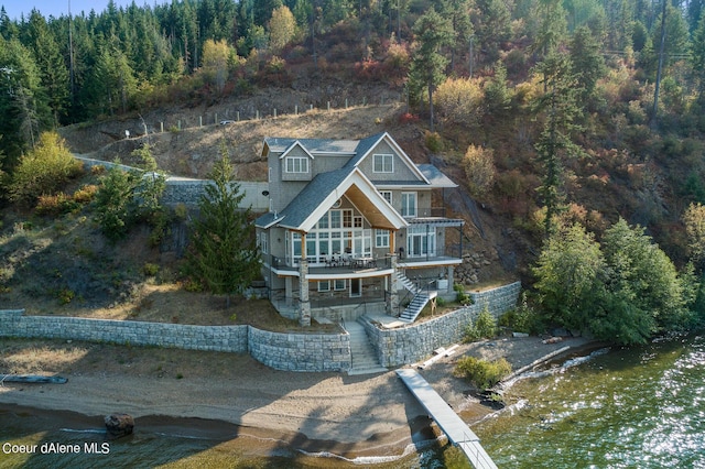 drone / aerial view featuring a forest view
