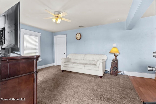 315 S 5th St, Saint Maries, ID 83861 - living room featuring visible vents, baseboards, a ceiling fan, and beamed ceiling