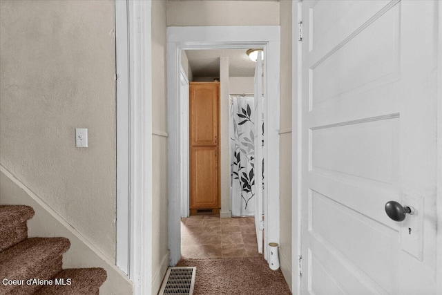 315 S 5th St, Saint Maries, ID 83861 - hallway with visible vents, a textured wall, and stairs