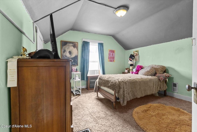 315 S 5th St, Saint Maries, ID 83861 - bedroom with carpet floors, baseboards, visible vents, and lofted ceiling
