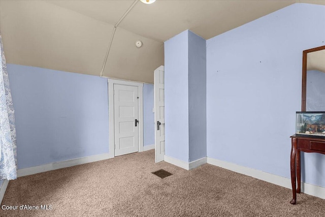 315 S 5th St, Saint Maries, ID 83861 - interior space featuring carpet flooring, baseboards, and vaulted ceiling
