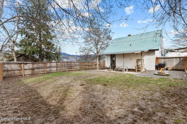 315 S 5th St, Saint Maries, ID 83861 - view of yard with a patio, entry steps, and a fenced backyard