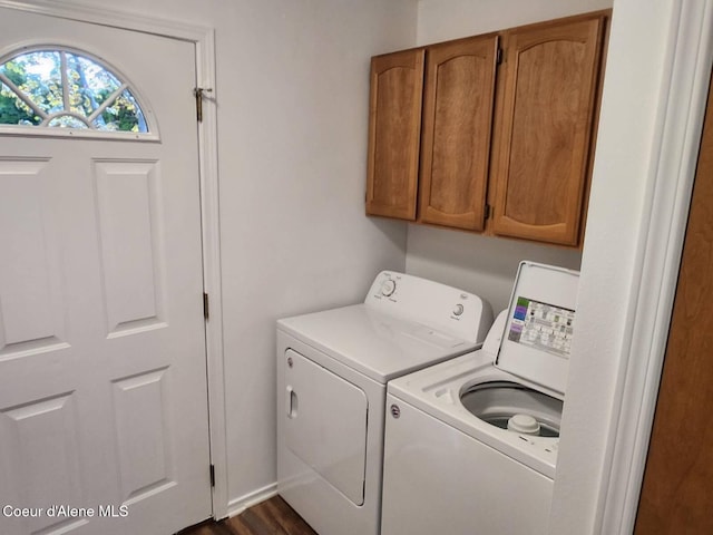 washroom with cabinet space and washing machine and clothes dryer