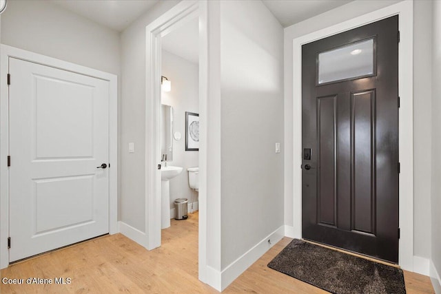 3402 N Cyprus Fox Loop, Post Falls, ID 83854 - foyer entrance featuring light wood-style floors and baseboards