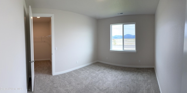 3402 N Cyprus Fox Loop, Post Falls, ID 83854 - unfurnished bedroom with carpet, a walk in closet, and a closet