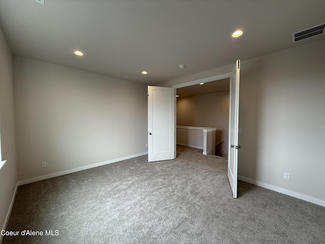 3402 N Cyprus Fox Loop, Post Falls, ID 83854 - unfurnished bedroom with carpet flooring and recessed lighting